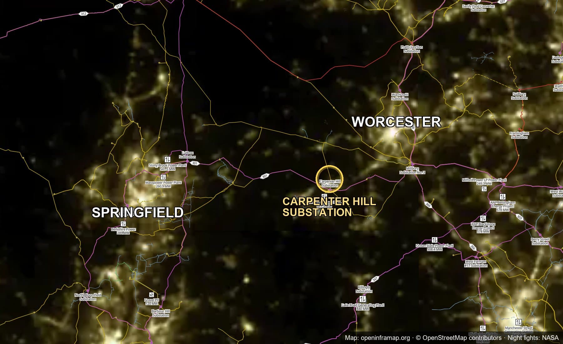A nighttime satellite view of central Massachusetts with transmission lines overlaid, showing the Carpenter Hill Substation between the lights of Springfield and Worcester