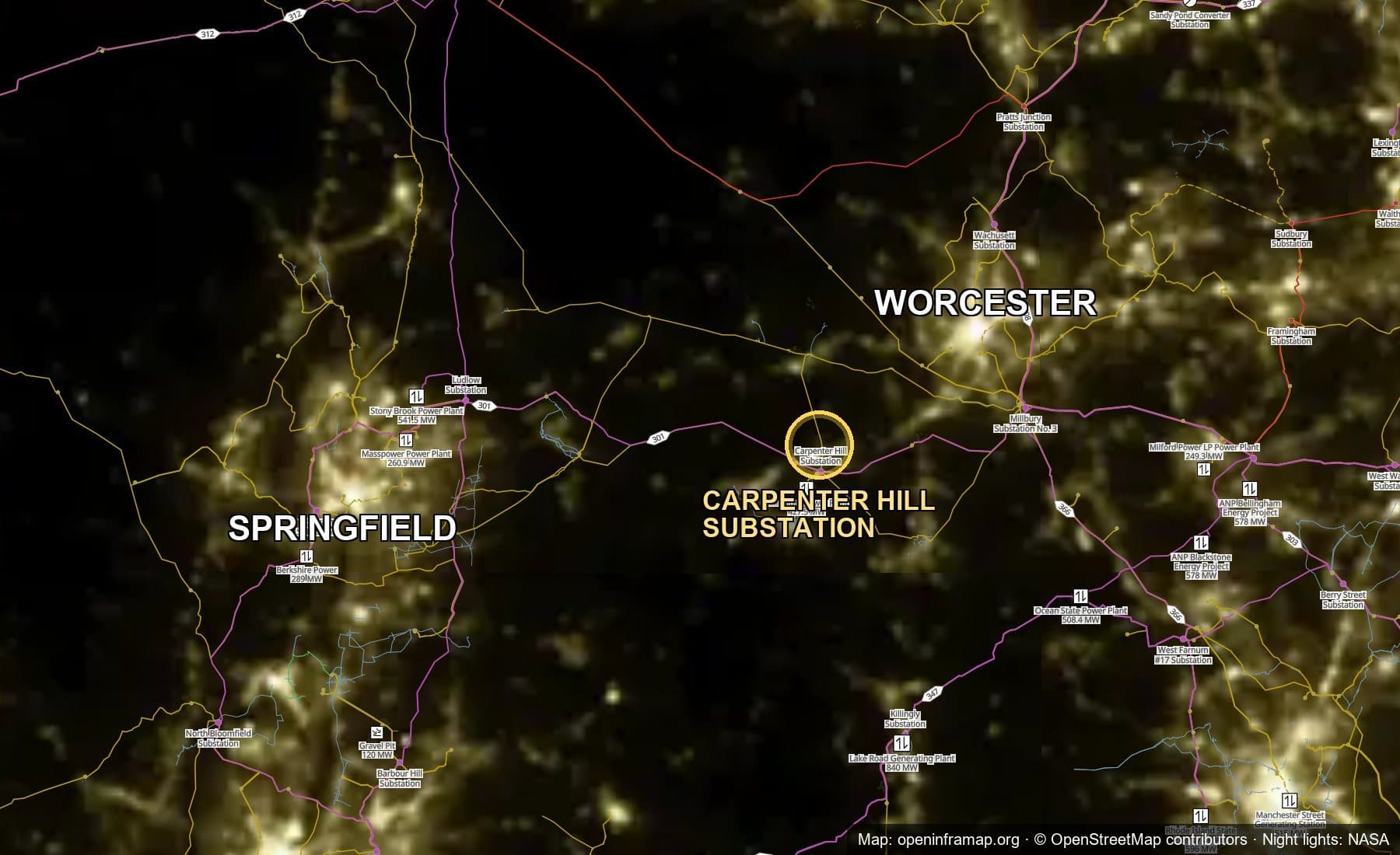 A nighttime satellite view of central Massachusetts with transmission lines overlaid, showing the Carpenter Hill Substation between the lights of Springfield and Worcester